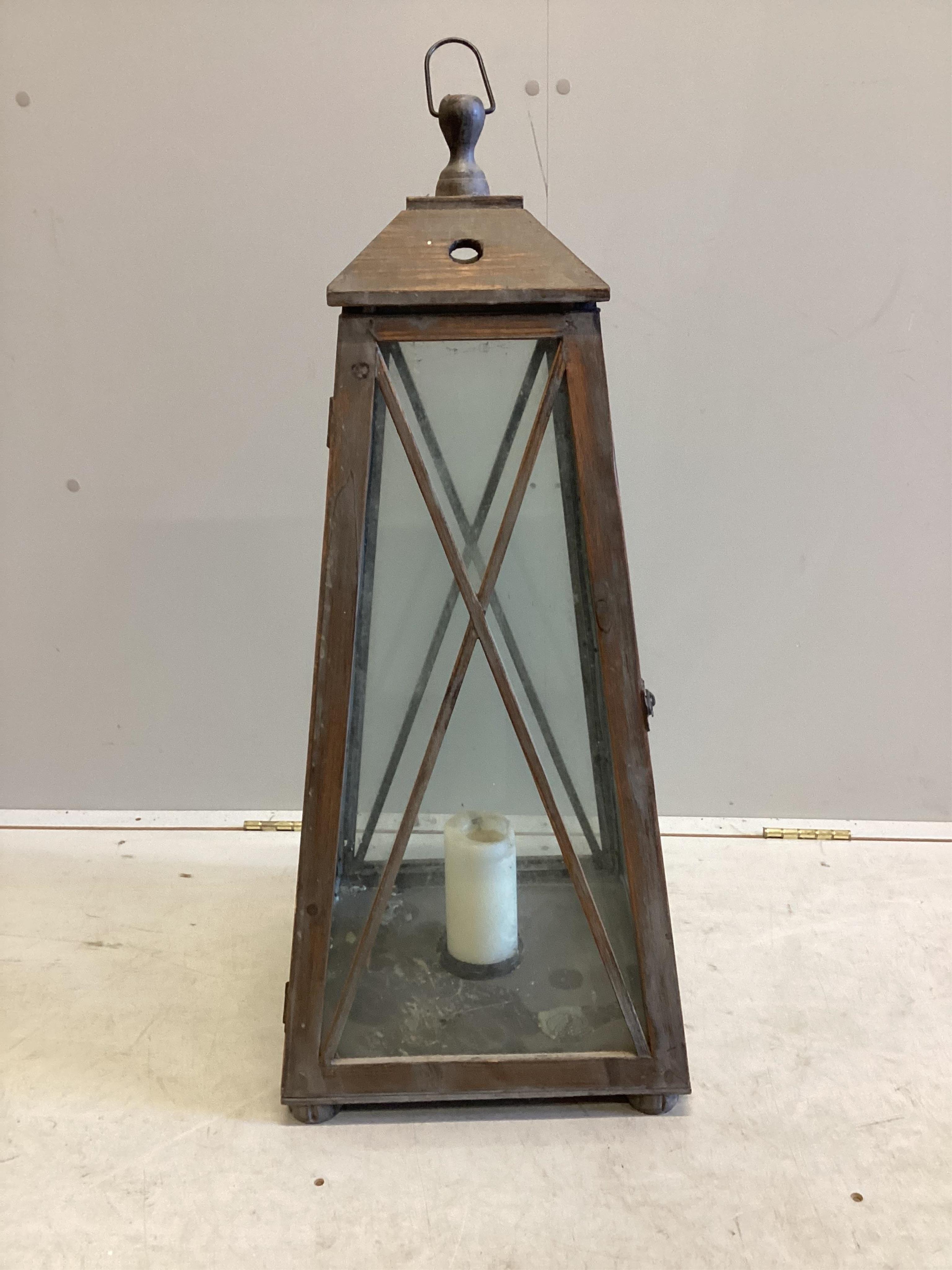 A large contemporary glazed pine interior candle lantern, height 86cm. Condition - good.